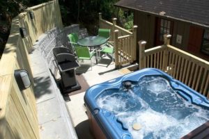 Relax in the hot tub of this Gatlinburg Chalet